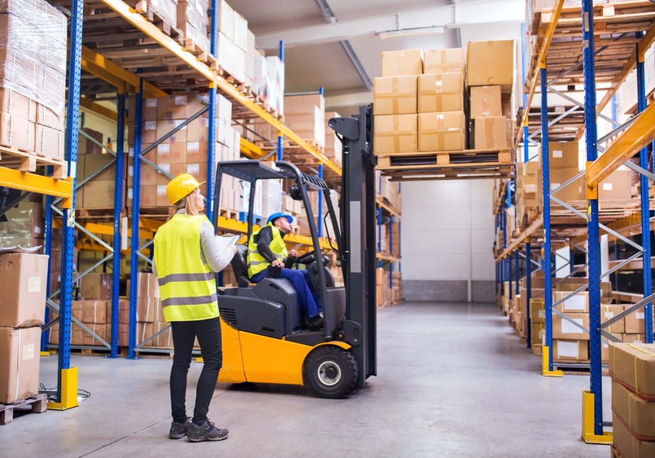 Young warehouse workers working together. warehouse efficiencies